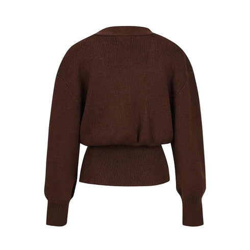 Brown sweater on a light gray background
