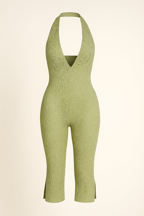 Green patterned jumpsuit on a beige background