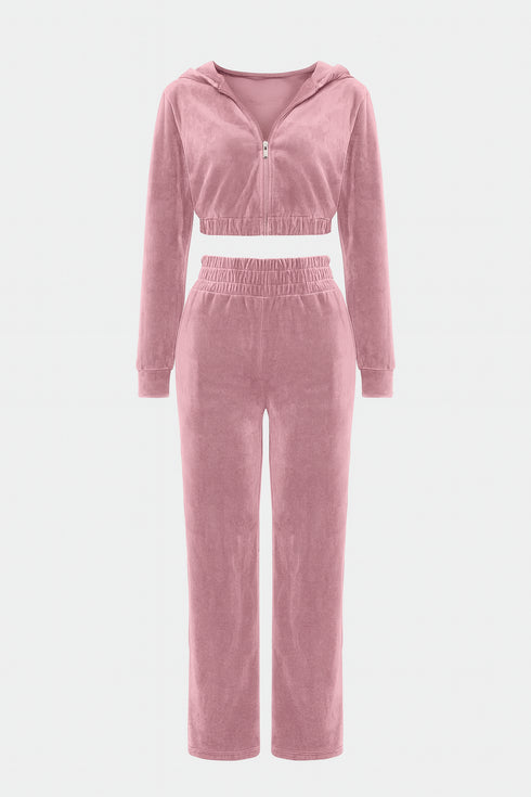 Pink velour tracksuit on a white background