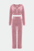 Pink velour tracksuit on a white background