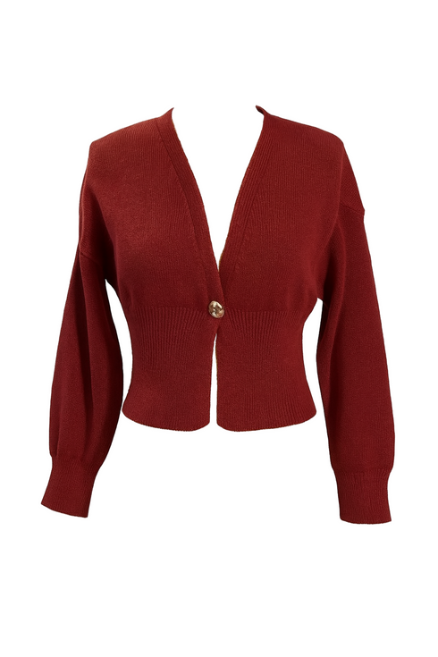 Red cardigan with a gold button on a light gray background