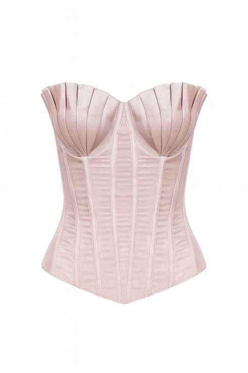 Pink corset top on a white background