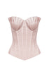 Pink corset top on a white background