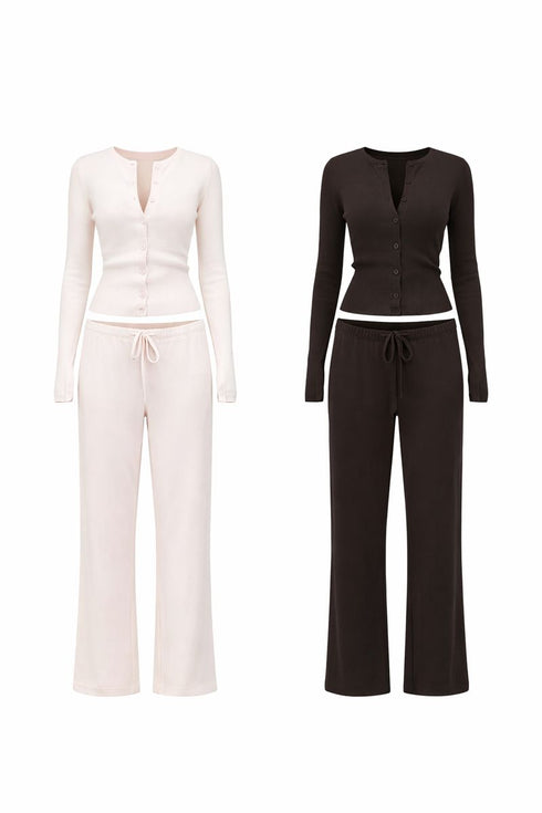 Two matching outfits in black and white on a white background