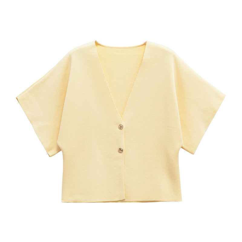 Light yellow short-sleeve cardigan on a white background