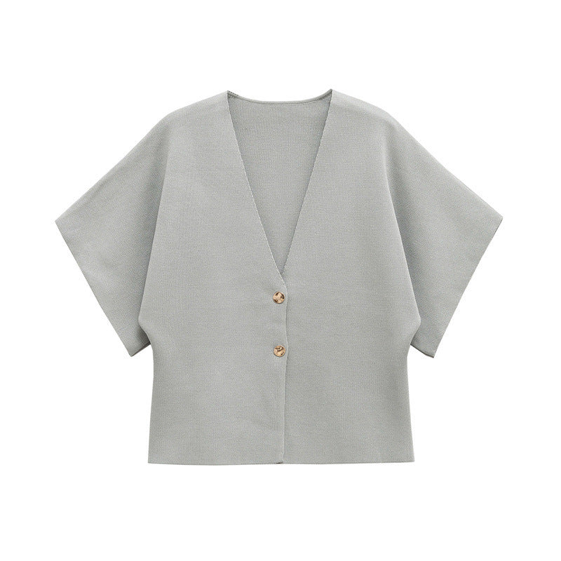 Light grey cardigan with short sleeves on a white background